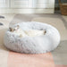 Blessing Sells light grey plush pet nest with a fluffy texture, perfect for cats and small dogs seeking comfort.