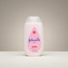 Blessing Sells Johnson's Baby Lotion with Aloe and Vitamin E in a pink bottle, 13.6 fl oz.
