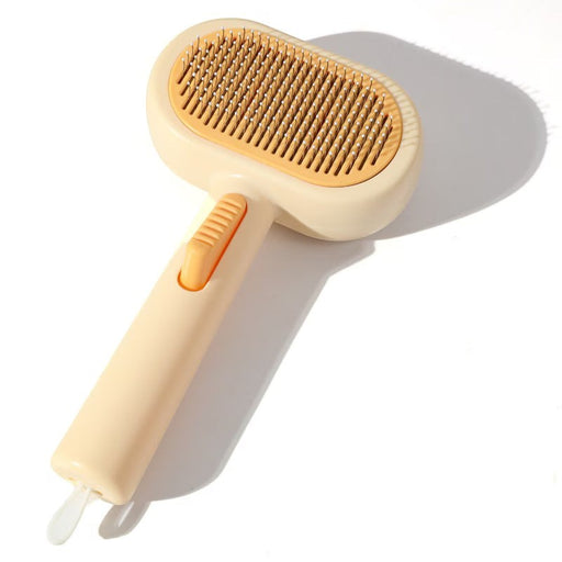Blessing Sells double-sided pet grooming comb with self-cleaning button, beige and orange.