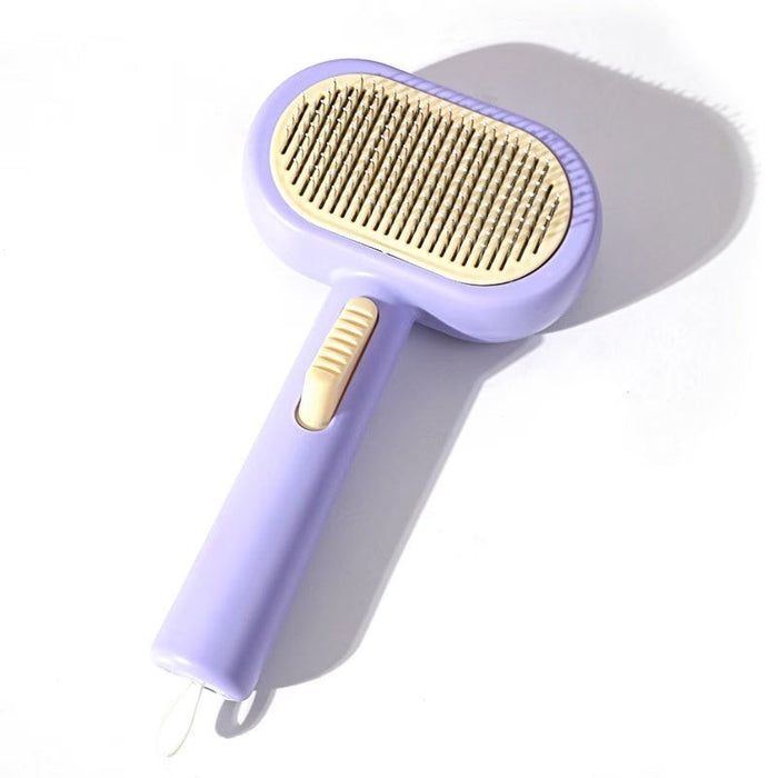 Blessing Sells purple self-cleaning pet grooming comb with beige bristles and a comfortable grip handle for fur removal.
