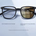 Blessing Sells unisex matte black full-frame smart glasses with photosensitive lenses that change color from clear anti-blue light indoors to tinted outdoors.
