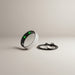 Blessing Sells smart ring with diamond inlay, fitness tracker, and USB charging cable. Silver textured band with green LED lights.