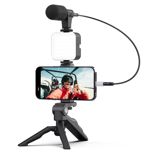 Blessing Sells smartphone vlogging kit with microphone and LED light on tripod. Includes phone mount and mini tripod for stable shots.
