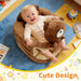 Blessing Sells brown plush toddler seat with a teddy bear design, featuring back support for infants learning to sit.